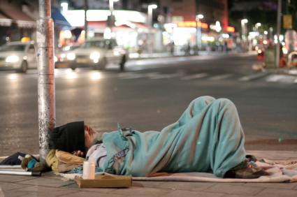 Homeless Man Sleeping in a Street