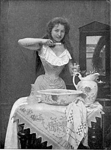1899 Parisienne Brushing Her Teeth